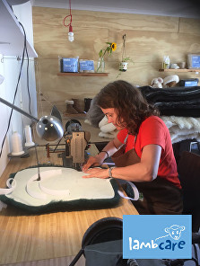 Cindy in sheepskin workshop