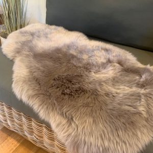Long wool coffee coloured lambskin on couch