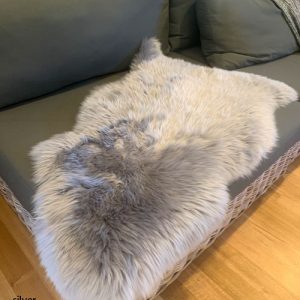 Long wool silver coloured lambskin on couch