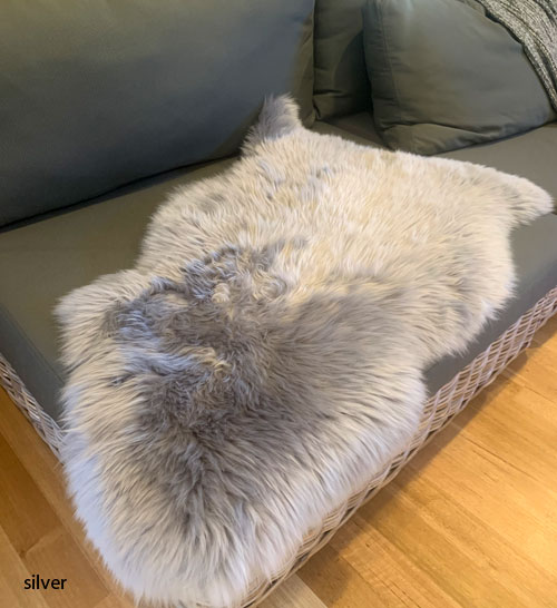 Long wool silver coloured lambskin on couch