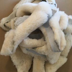 Pile of ivory sheepskin pieces